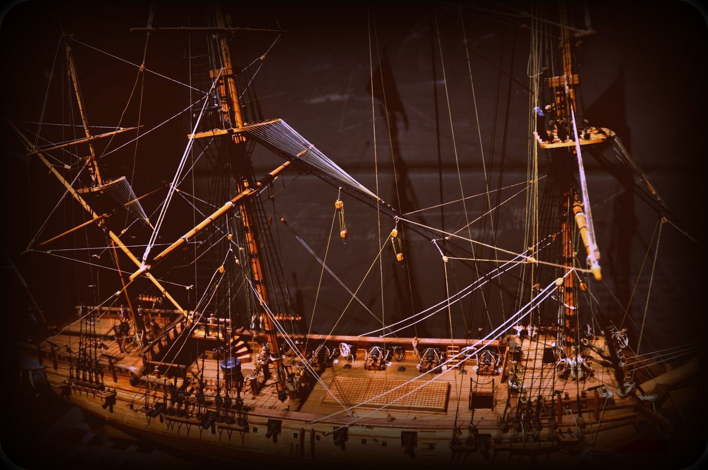 Modern scale model of the Whydah Gally, fully rigged with three masts and gun ports visible along the hull.